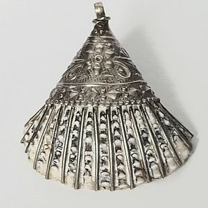 Unique seashell pendant covered in silver.